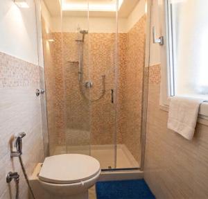 a bathroom with a shower with a toilet at Sole & Luna in Elmas