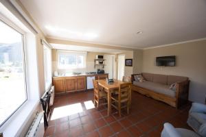 a living room with a couch and a table at Lo de Tomy in El Chalten