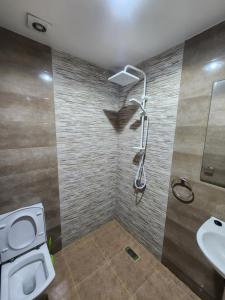a bathroom with a toilet and a sink at Appartement darna à côté décathlon agadir 2chambre et salon in Agadir +12 photos