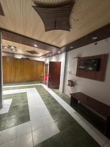 a large room with a large room with a ceiling at Hotel Kamla Palace in Haridwār