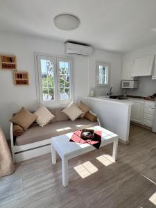 a living room with a couch and a table at Costa Mernorca in Son Xoriguer