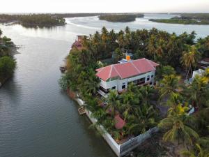 an aerial view of a resort in the water at Halfmoon Homestay in Kalyānpur