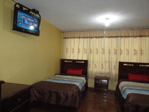 Postel nebo postele na pokoji v ubytování Hotel Navarra
