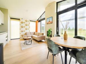 a living room with a table and chairs at Bollen in Oud-Ade