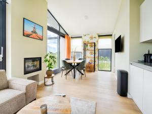 a living room with a couch and a table at Bollen in Oud-Ade