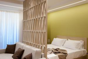 a bedroom with a bed with a large wooden wall at Casa Majore in Chiaramonte Gulfi