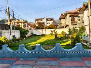 a view of a yard from a house at The Holt Gardens in Srinagar