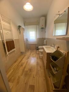 a bathroom with a sink and a toilet at Karina in Carini +21 photos