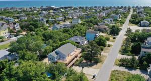 an aerial view of a residential neighborhood with houses at Casa Bella - Duck, Bayberry Bluffs, Ocean View, 500 Yds to Beach, Pool, Hot Tub, Playset, Pets OK in Duck