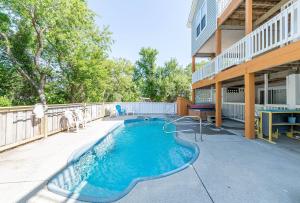 a swimming pool on the side of a building at Casa Bella - Duck, Bayberry Bluffs, Ocean View, 500 Yds to Beach, Pool, Hot Tub, Playset, Pets OK in Duck