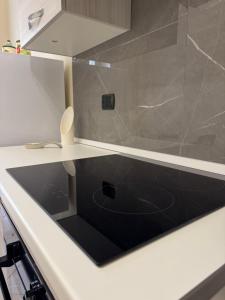 a shower with a glass door in a kitchen at Casa del Corso Apartments in Avola +31 photos
