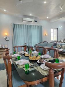 a living room with a table with food on it at Ellara Homes in Udaipur