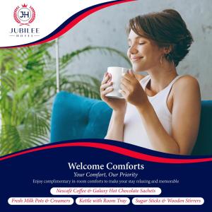 a woman is holding a cup of coffee at Jubilee Hotel Kensington in London