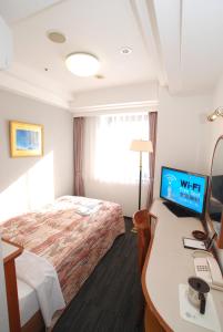 Hotel Arstainn tesisinde bir odada yatak veya yataklar
