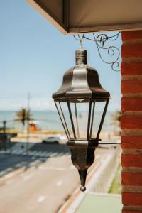 a street light hanging from the side of a building at Hotel da Praia in Vila Velha +86 photos