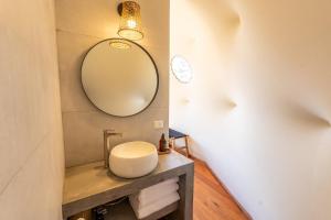 a bathroom with a sink and a mirror at Moreno Camp - Glamping with a view in El Calafate +51 photos