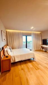 a bedroom with a bed and a large window at Villa Mar - Baia Formosa in Baía Formosa +31 photos