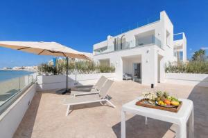 a villa with a view of the ocean at Scirocco Boutique Eco Hotel in Torre Pali