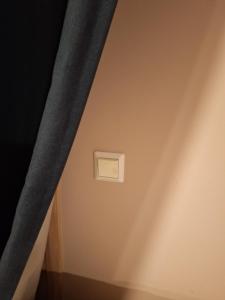 a room with a curtain and a light switch at Slettavegen1a in Time