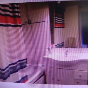 a bathroom with a sink and a tub and a mirror at chambre double dans appartement in Le Kremlin-Bicêtre