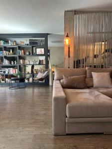 a living room with a couch and a table at LOFT "EL PARQUE" in Níjar