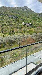 a glass balcony with a view of a mountain at Casa Oliva in Orahovo +2 photos