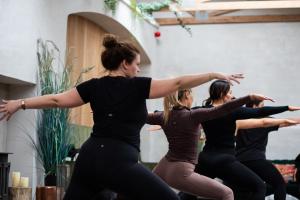 a group of women dancing in a dance class at Elements Lodges in Pettigoe