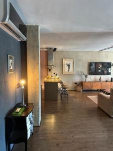 a large living room with a kitchen and a living room at LOFT "EL PARQUE" in Níjar
