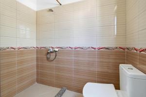 a bathroom with a toilet and a shower at Villa Deart Berat in Berat +42 photos
