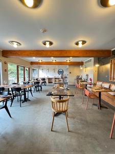 a dining room with wooden tables and chairs at Cascadas Hotel in Puerto Octay