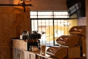 a kitchen with a counter with a coffee maker and a window at Akoma San Pancho in San Francisco +33 photos