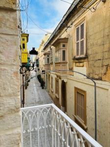 a view of an alley from the balcony of a building at VillageStay in Rabat