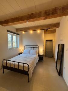 a bedroom with a large bed in a room at VillageStay in Rabat