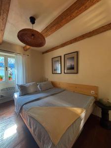 a bedroom with a large bed in a room at Franka Apartment in Piran
