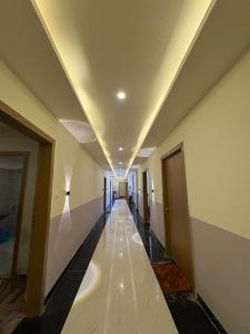 a hallway of a building with a long corridor at Lagoon Resort in Suitha