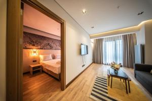 a hotel room with a bed and a large mirror at Hay Rezidans in Istanbul