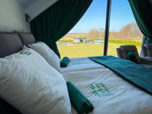 a large bed in a room with a window at POKOJE GOŚCINNE U MIKOŁAJA in Pękanino +82 photos