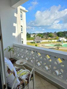 a balcony with a view of a golf course at Malindi Getaway, Near Beach in Malindi