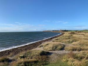 a view of the shoreline of a beach at Beachpoint-Fehmarn in Burgtiefe auf Fehmarn 