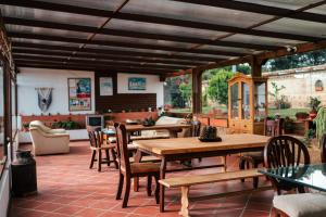 a patio with tables and chairs in a restaurant at Cabañas Sol y Luna in Villa de Leyva