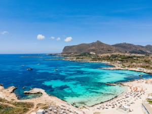 an aerial view of a beach with people and the ocean at Stabilimento Lido Burrone in Favignana