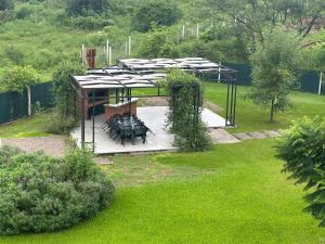 an overhead view of a park with a group of tables at Monoambiente 2 Village Golf in Yerba Buena