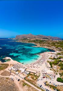 an aerial view of a beach with a lot of people at Stabilimento Lido Burrone in Favignana +126 photos
