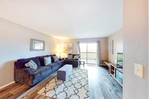 a living room with a couch and a table at Vineyards 2909 #3 in Branson