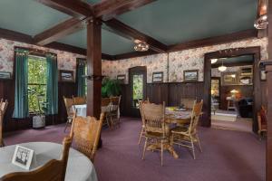 a dining room with a table and chairs at McCleary Hotel in McCleary