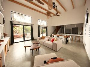 a living room with a couch and a table at Canopy Lodge Marloth in Marloth Park