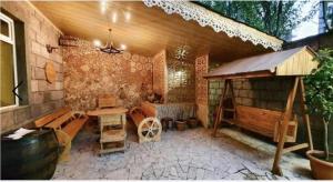 a room with a table and chairs in a house at M&W Hostel in Yerevan