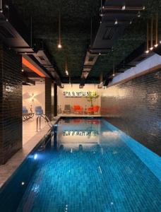 a large swimming pool in a large room with at BK Apartman in Zlatibor