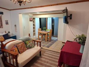 a living room with a couch and a table at 65 Rowweklip in Jongensfontein