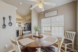 a kitchen and dining room with a table and chairs at On the Green in Branson